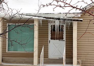 Snow and ice damage to roof gutter.